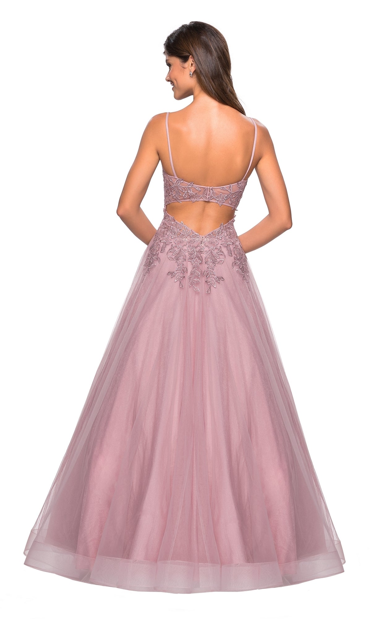A woman wears the La Femme 27569 Cut-Out Embroidered Tulle Prom Dress, a floor-length mauve gown with thin straps, floral embroidered bodice, and back cutout detail.